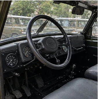 Driver cockpit with classic Soviet red star steering wheel and round analog instrument gauges
